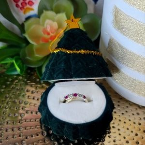 White and yellow gold Ruby and Diamond criss-cross band size 6.